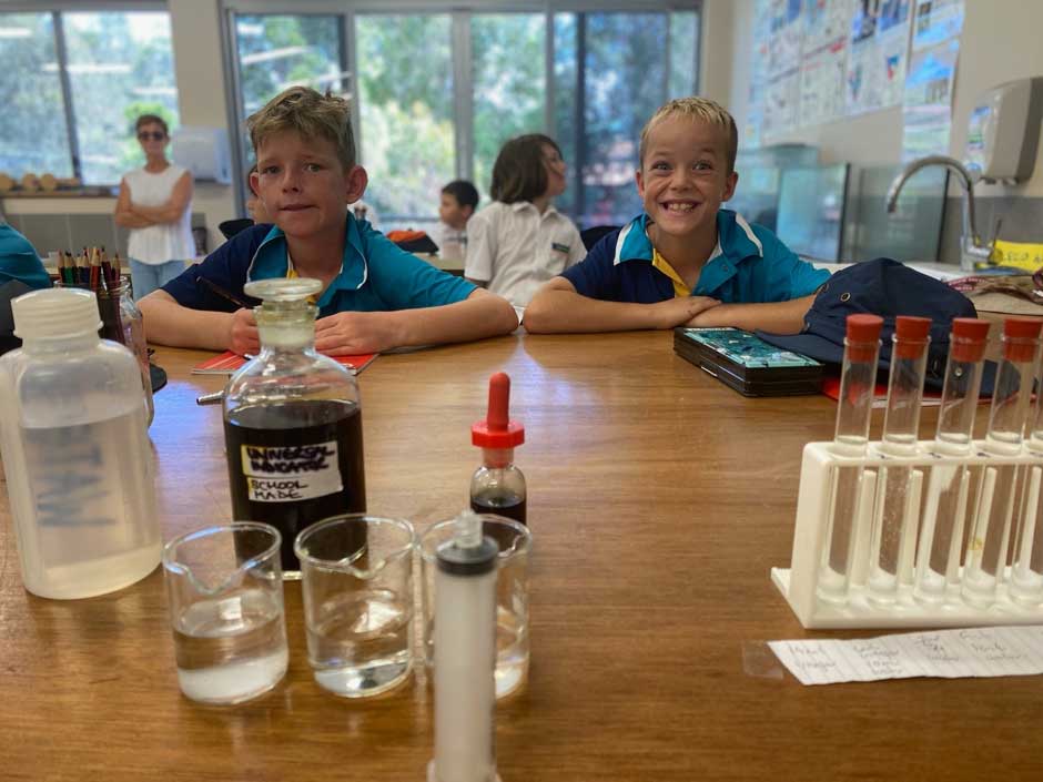 Cameron & Roman testing the PH level in the water directly taken from the fish tank in the aquaponic system